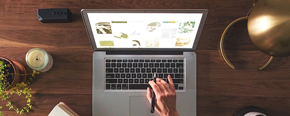 laptop website on desk flatlay