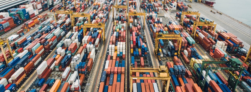 Dock machinery processing rows of crates