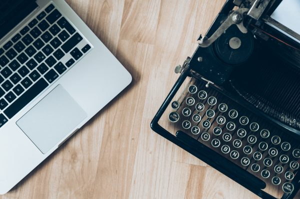 mac book next to a retro type writer trymyui usability comparison