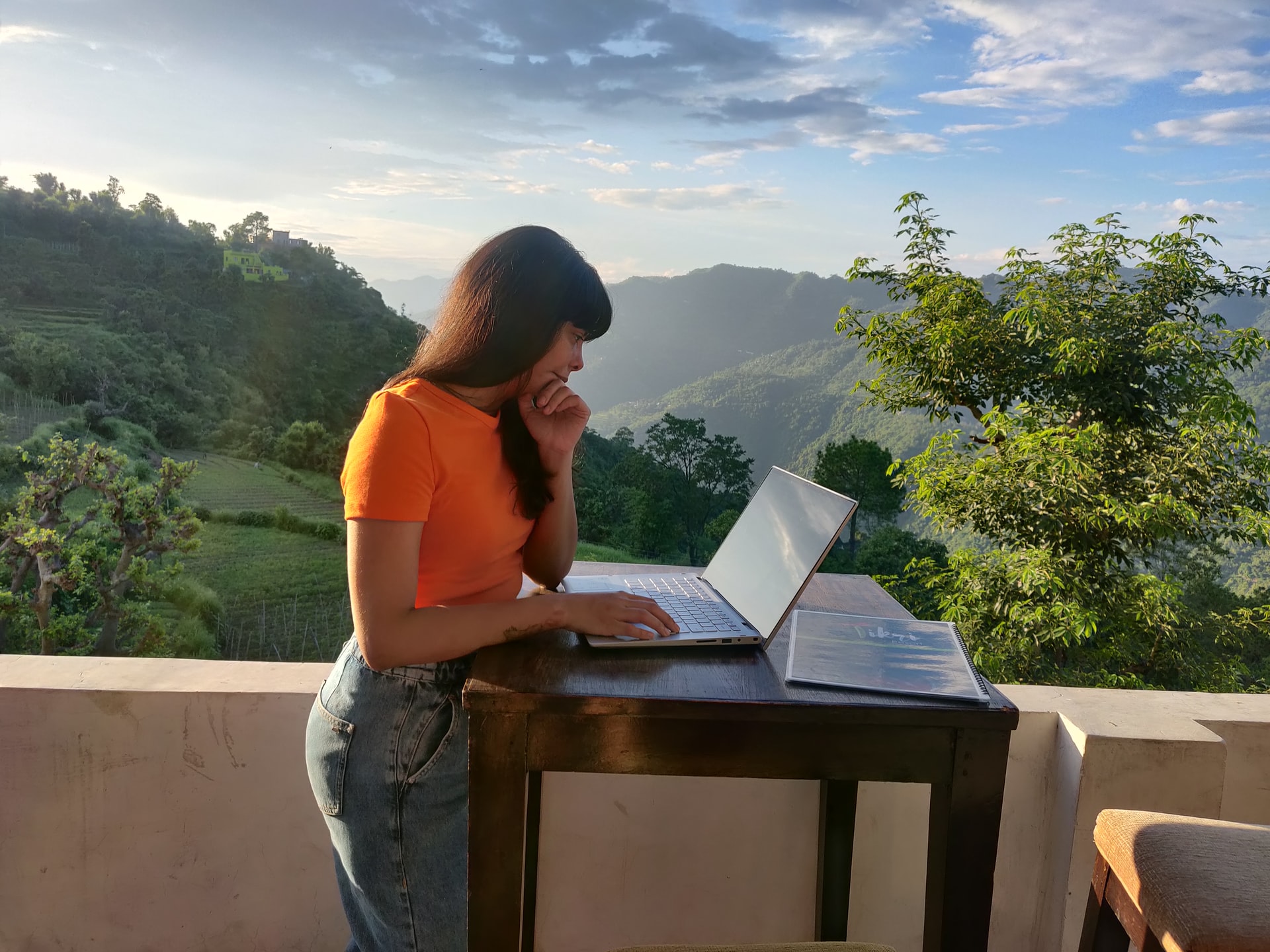 remote user research woman outdoors on laptop