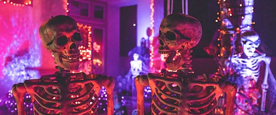 Two skeletons at a haunted house