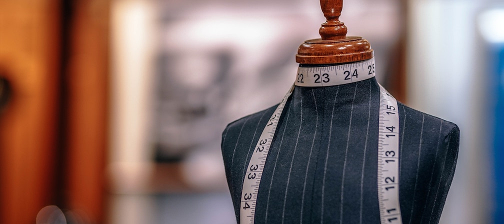 Tailoring mannequin with a measuring tape