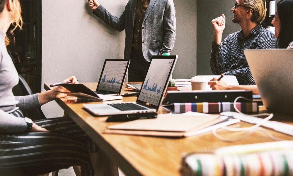 ux research and design team in a conference room