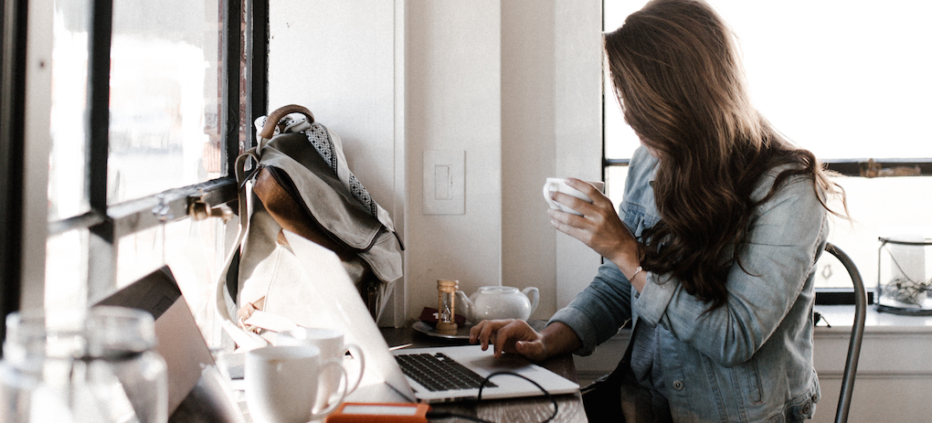 A user on her computer