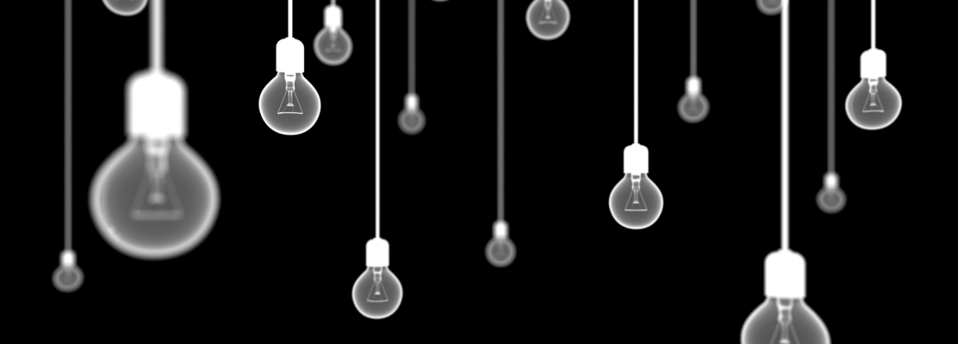 Image of hanging lightbulbs in a dark space